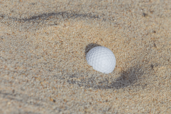 unplayable-embedded-ball-on-the “lip- of-the-bunker
